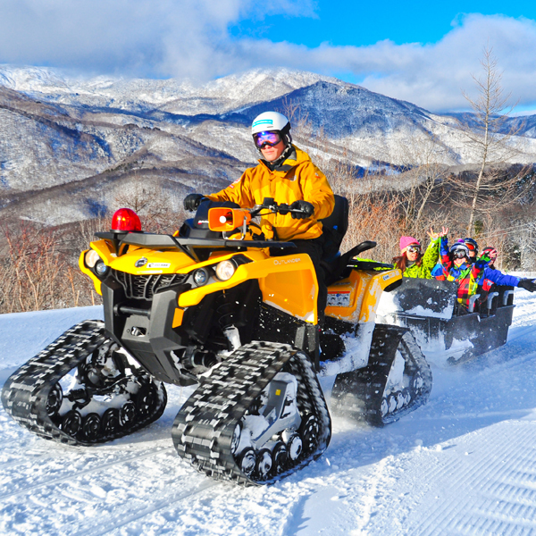 Skiers enjoying snow rafting