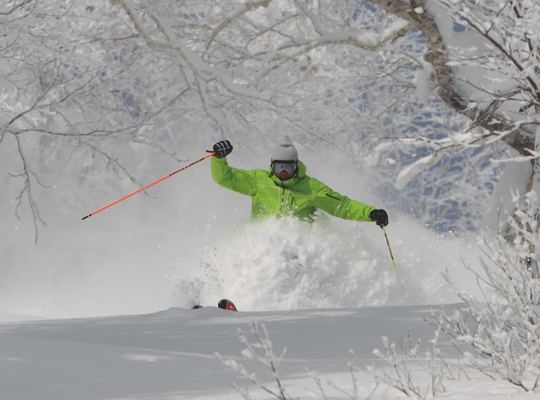 A skier flying down a slope