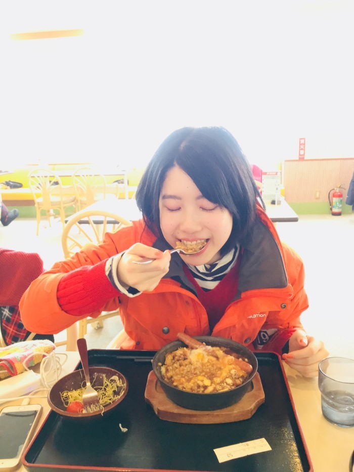 Female staffer enjoying her delicious food court meal