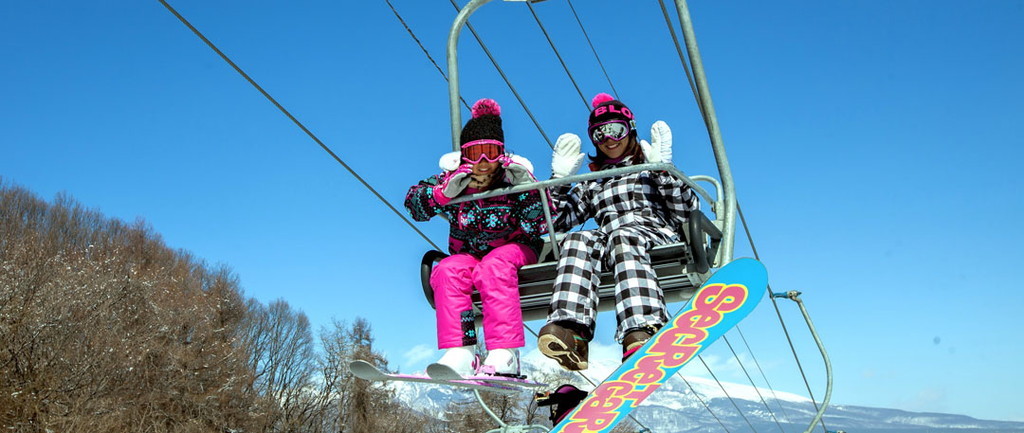 Skiers riding the lifts