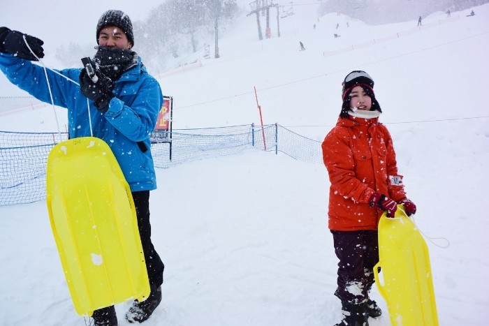 The staffers enjoying the sled slope